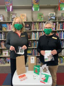photo of library staff with craft kits