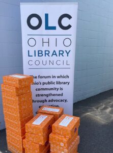 photo of boxes and OLC banner