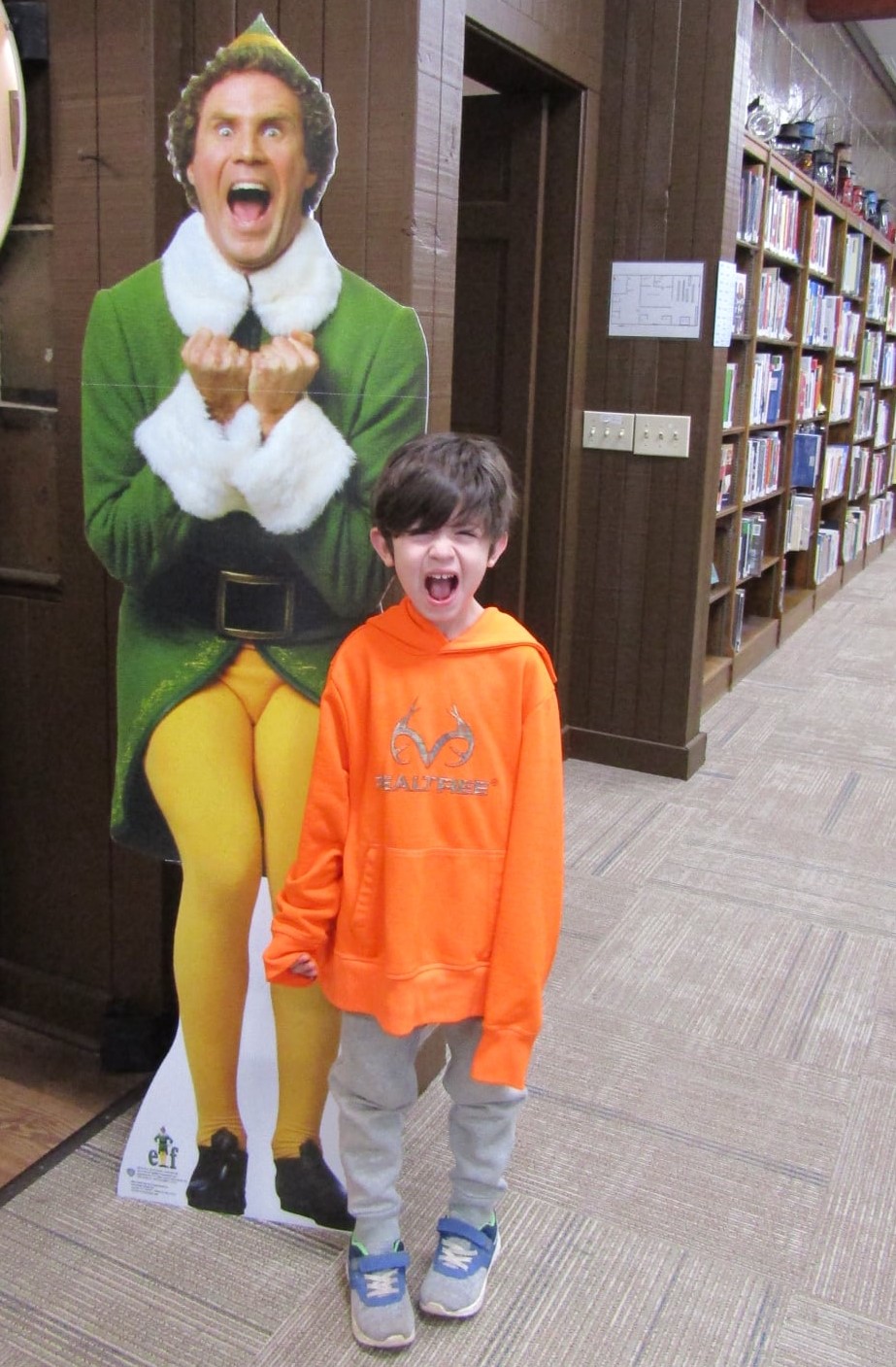 photo of Buddy the Elf and young boy.