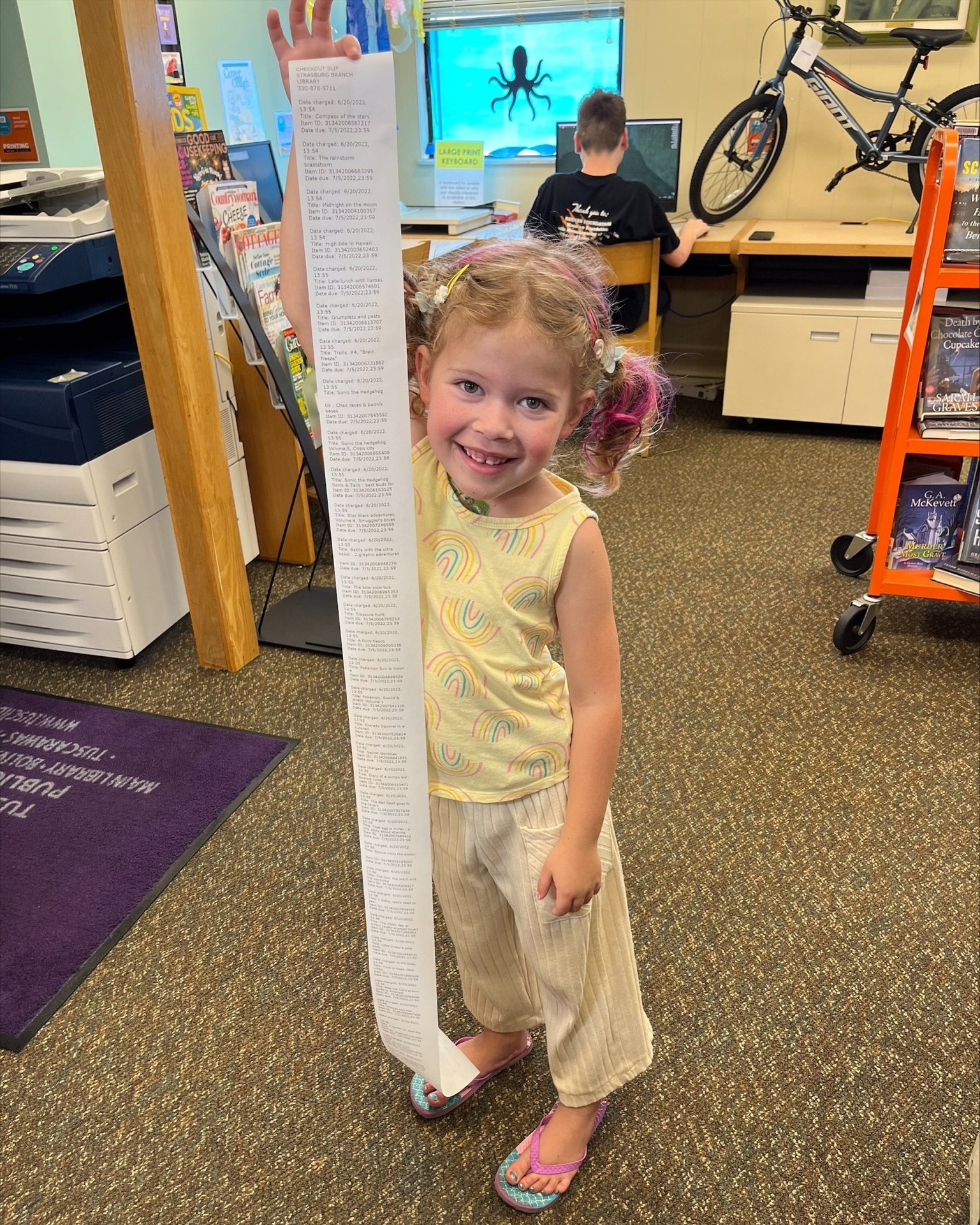 photo of girl with long library receipt