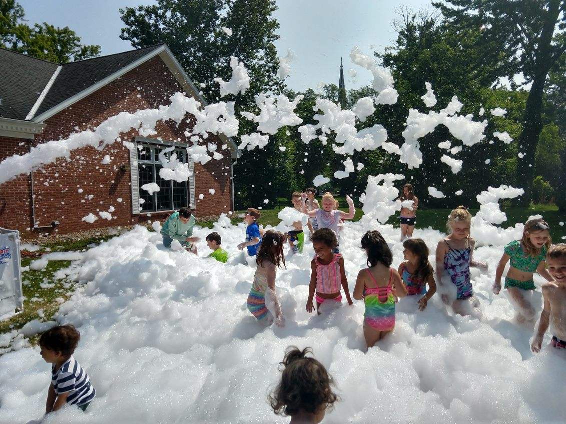 photo of kids playing in foam