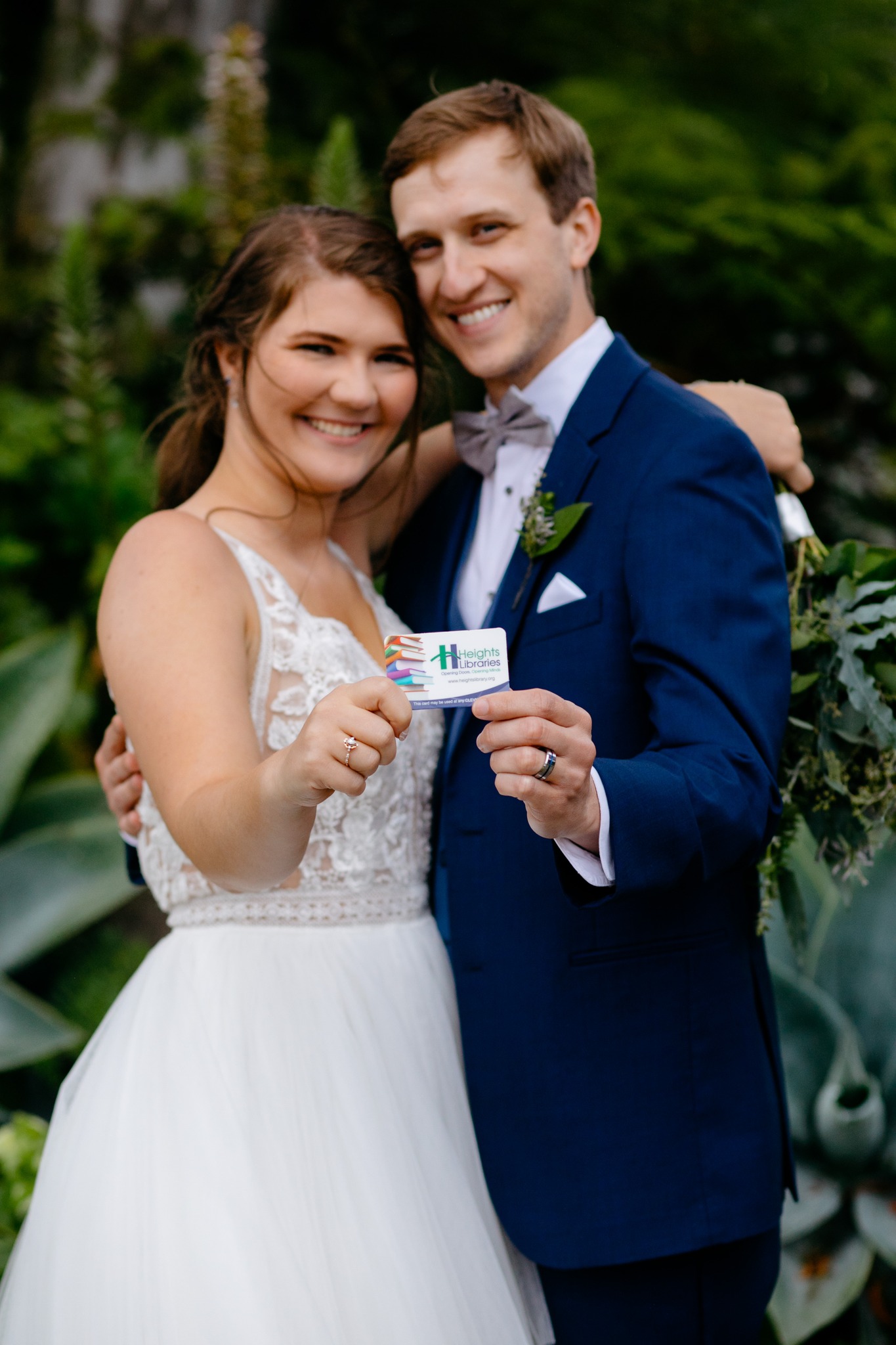 photo of bride and groom with library card