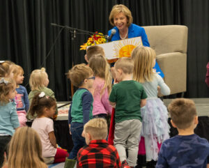 photo of Mrs. DeWine reading a book to children.