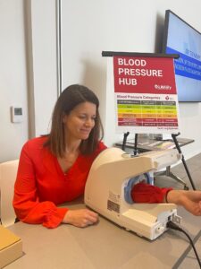 Woman getting blood pressure checked at library