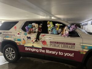photo of library SUV filled with stuffed animals