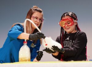 Woman and girl performing science experiment