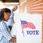 young woman at voting booth